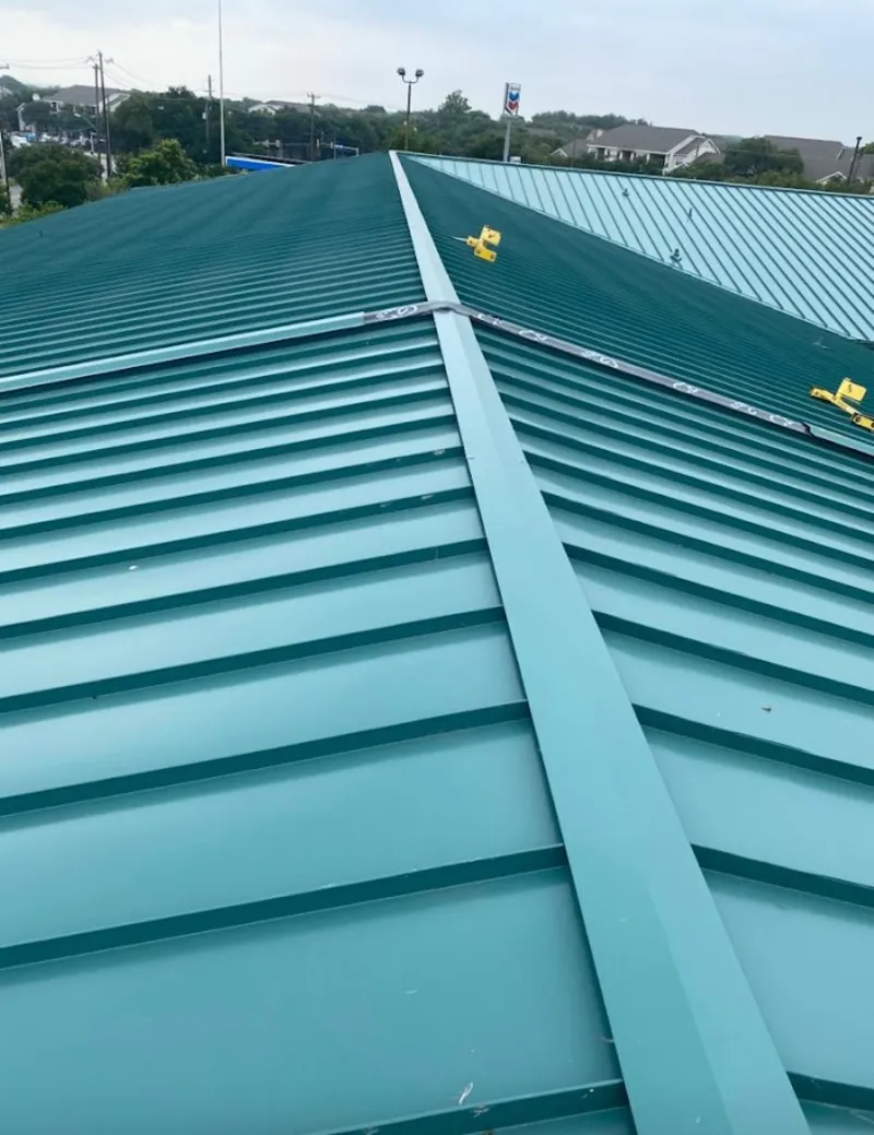 Green commercial metal roof ridge and valley for Metal Roof Repair in Seabrook